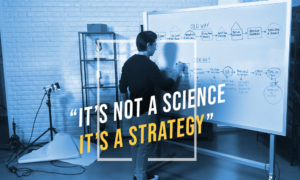 Dean Graziosi at whiteboard. It's not a science, it's a strategy."