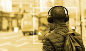 man listening to music with headphones