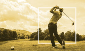 man swinging golf club