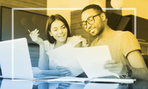 couple going over finances at a computer