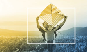 father and son with kite