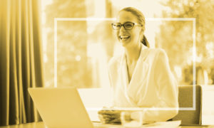 woman smiling at desk