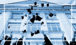 students throwing graduation caps